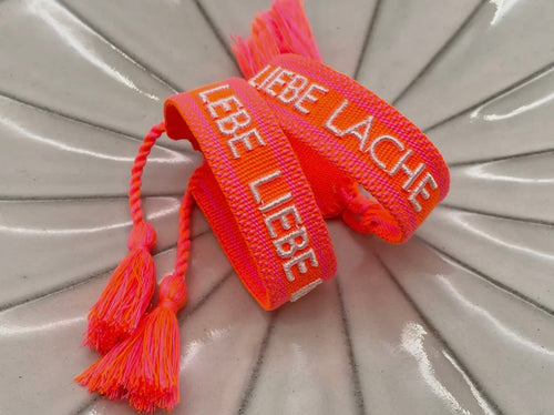Webarmband "Lebe Liebe Lache" neon orange/neon pink
